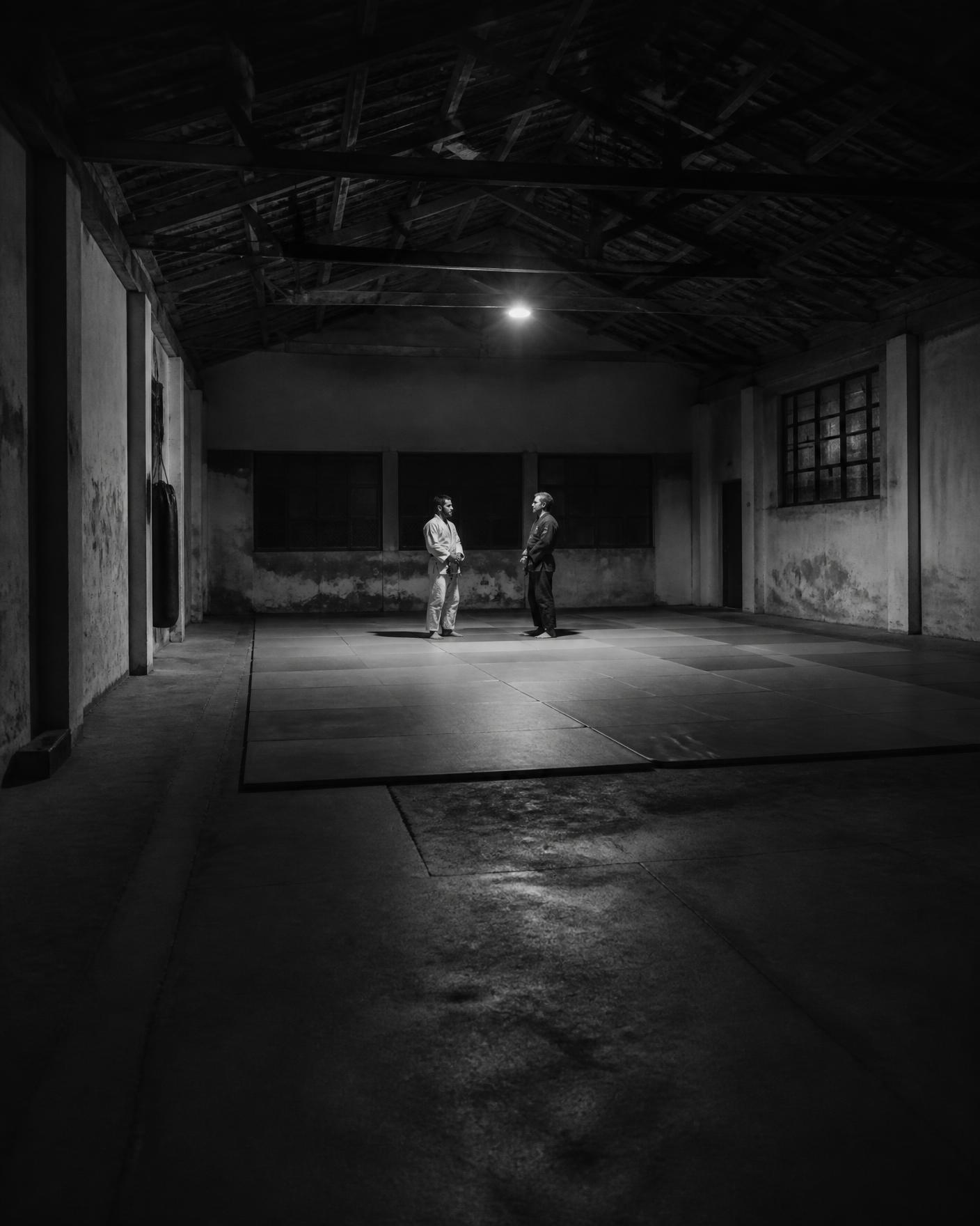 Two founders talking in an empty academy after hours